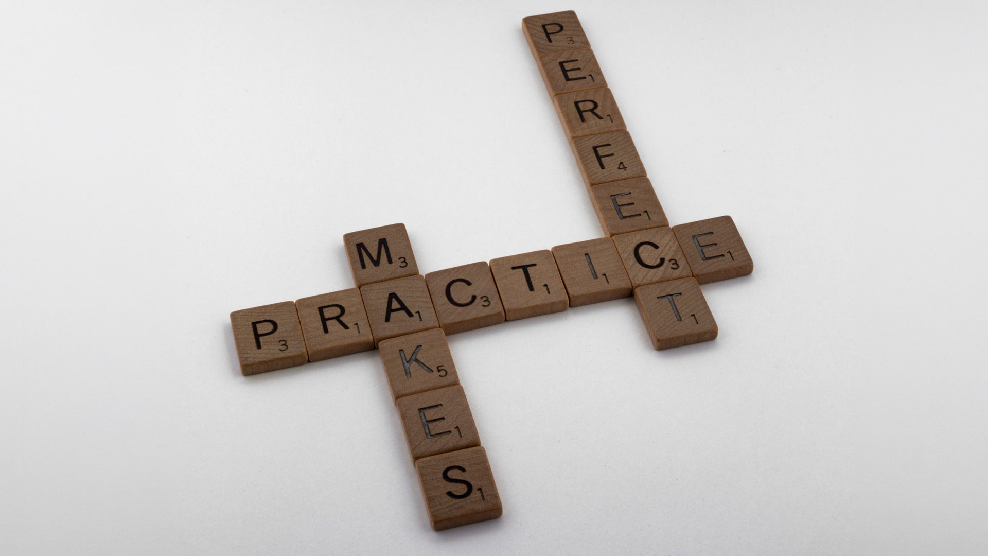 Hawkins-2026-10-07-1 Scrabble™ tiles are organized in a way that says "Practice makes perfect."